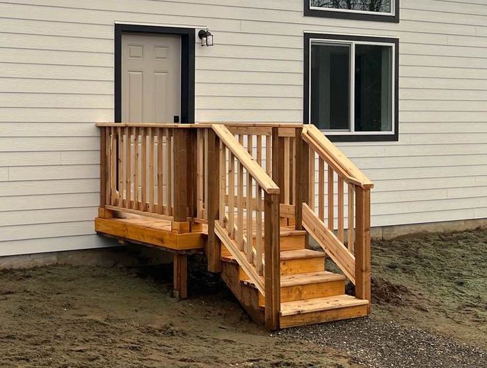 Small cedar deck with railings