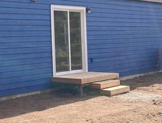 Low deck at a sliding door