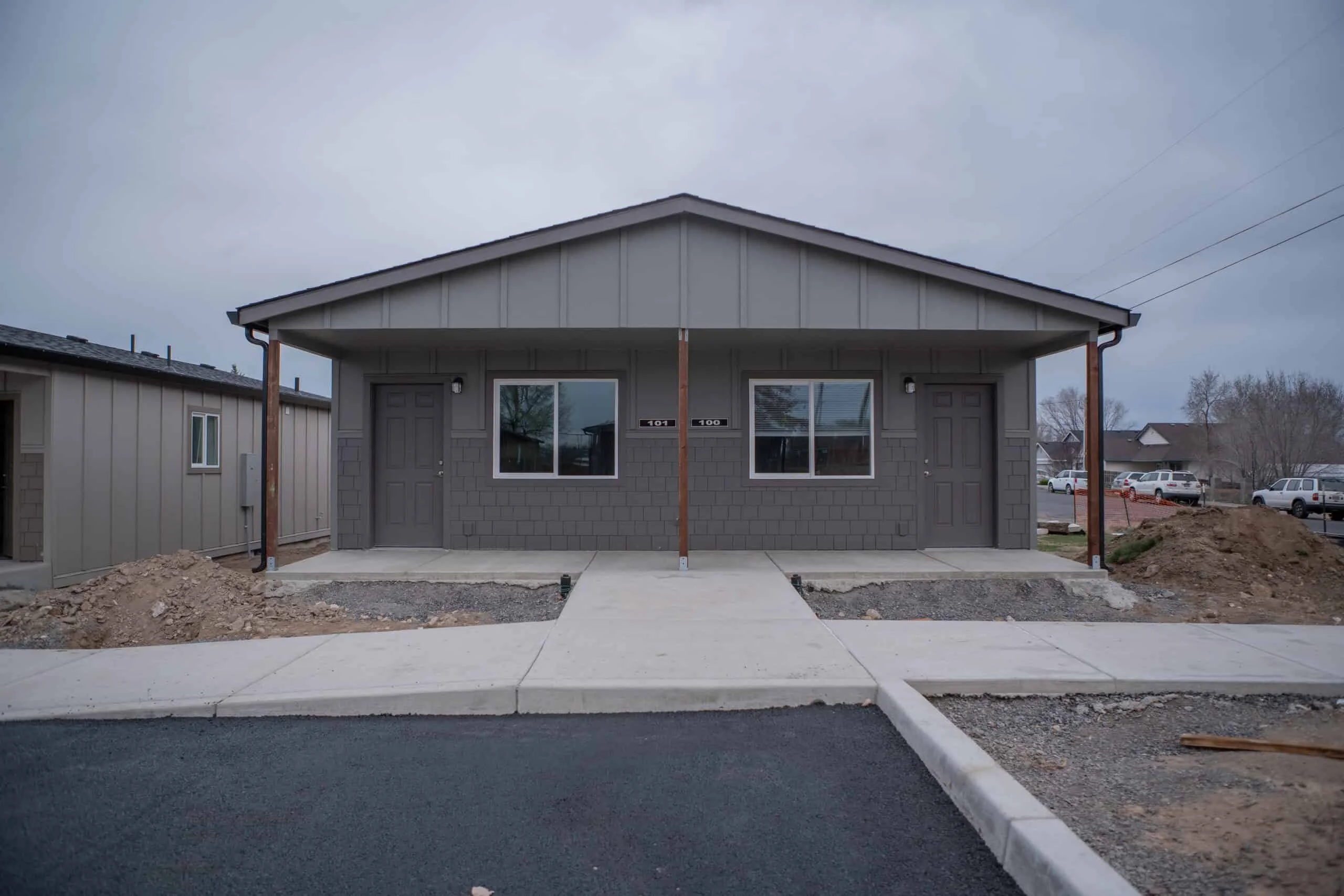 Wolf duplex-style homes in Madras, Oregon, with landscaping and site work still underway