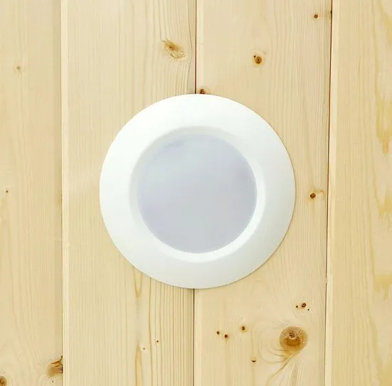 LED disc light in a pine ceiling