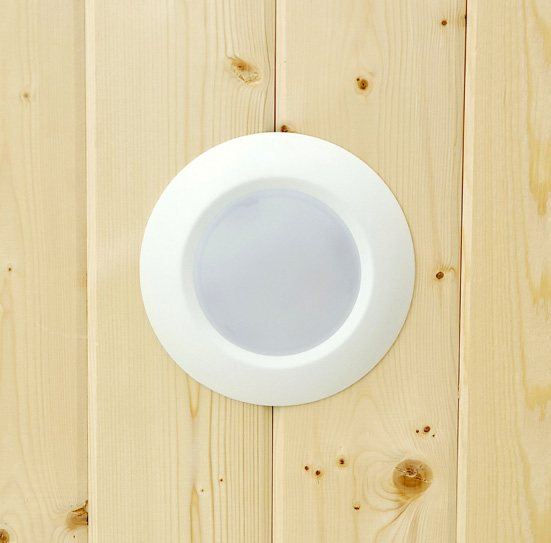 LED disc light in a pine ceiling