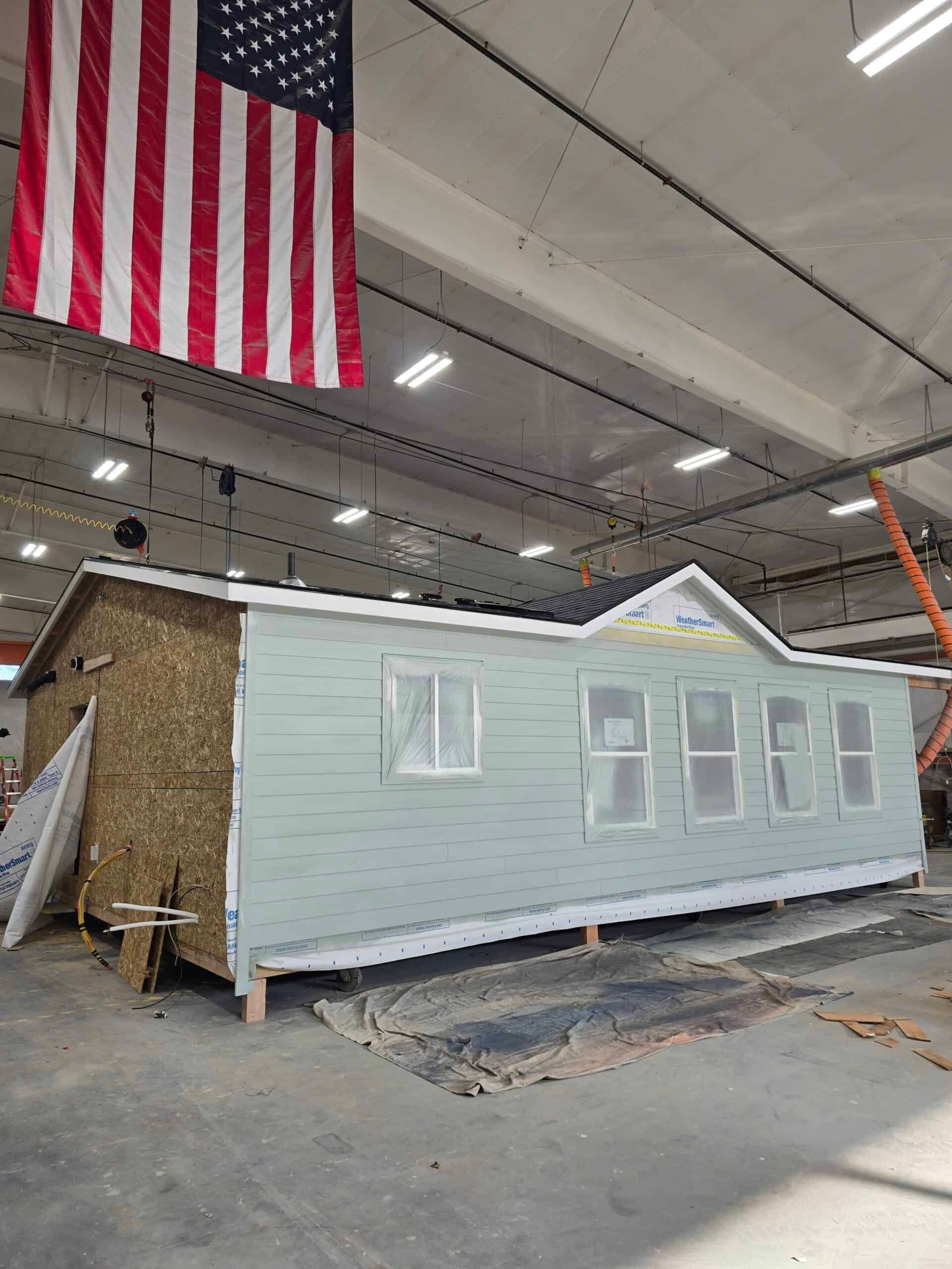 Two sections of a Wolf home pushed together, with siding still open at the seam