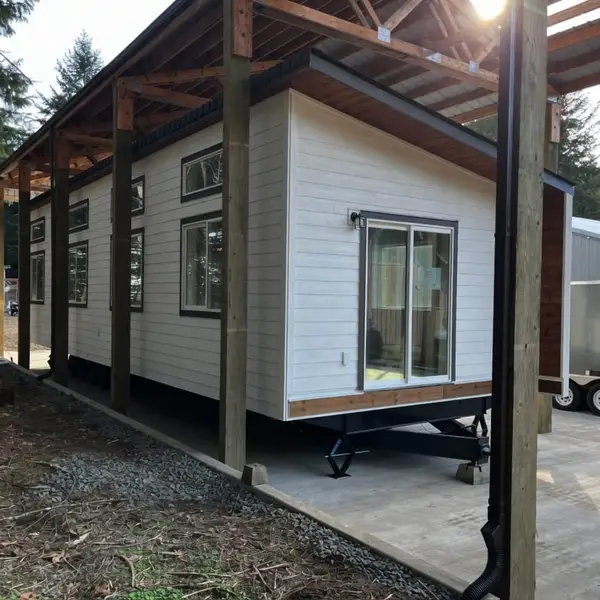 White Wolf home on a trailer under a timber cover