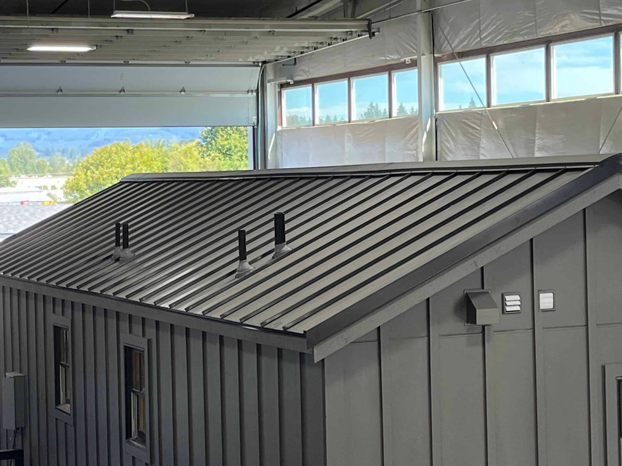 Roofing Choices: Composite Shingles vs. Metal Roofing