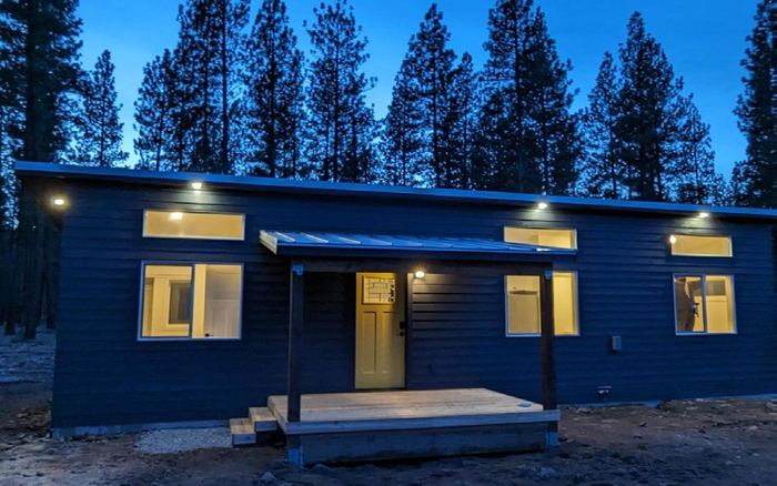 Wolf home at dusk with soffit lights on