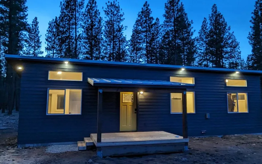 Wolf home at dusk with soffit lights on