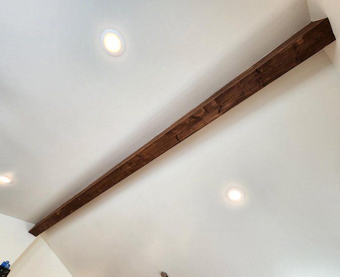 Stained fir-wrapped ridge beam