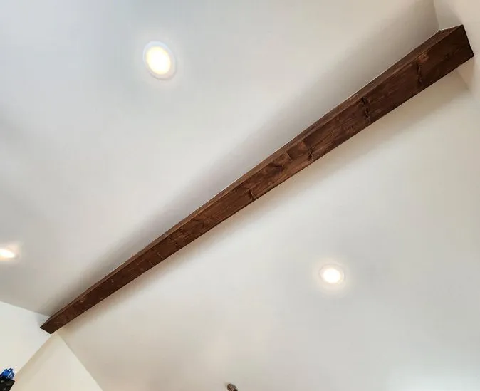 Stained fir-wrapped ridge beam