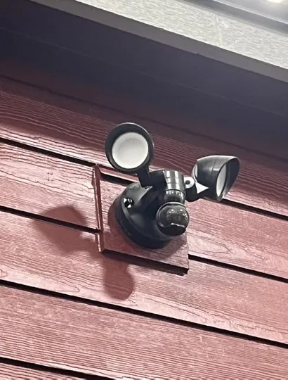 Flood light on red siding