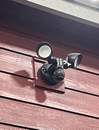 Flood light on red siding