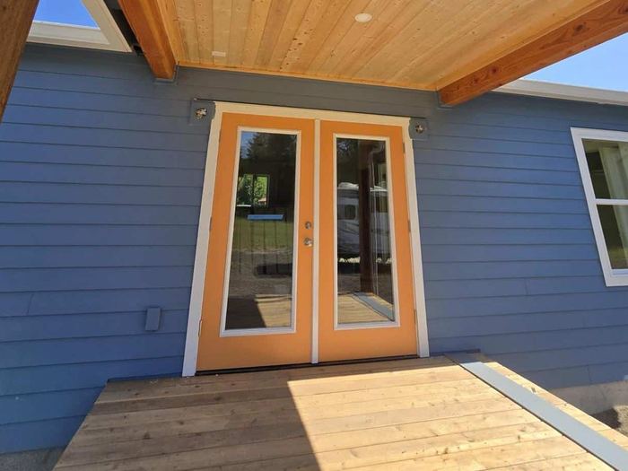 Wood-toned French doors on a Wolf home