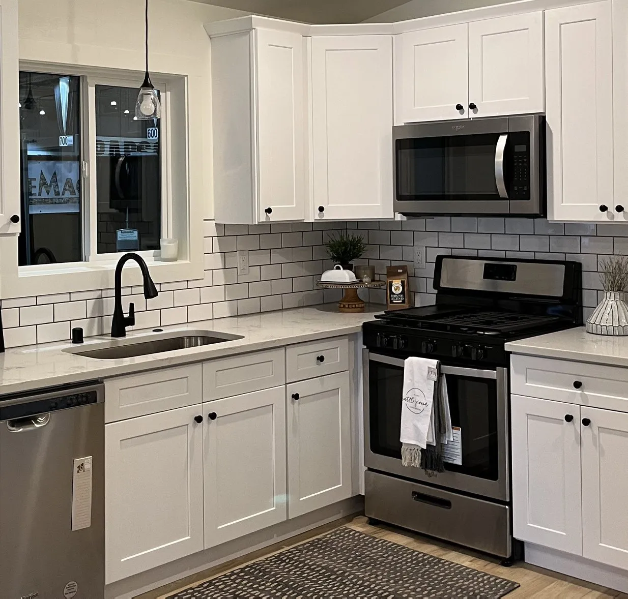 White Shaker kitchen with stainless appliances