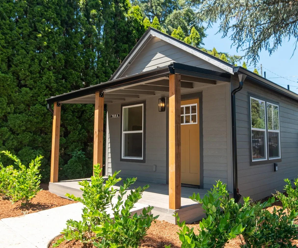 Gray Wolf home with a covered cedar porch