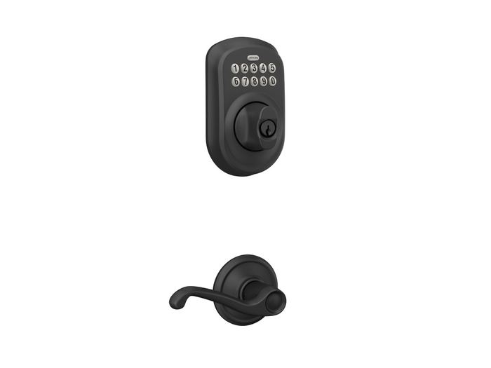 Black keypad deadbolt and lever on a red door