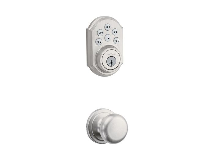 Brushed-nickel keypad deadbolt and knob on a purple door