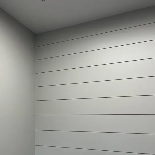 White painted shiplap wall
