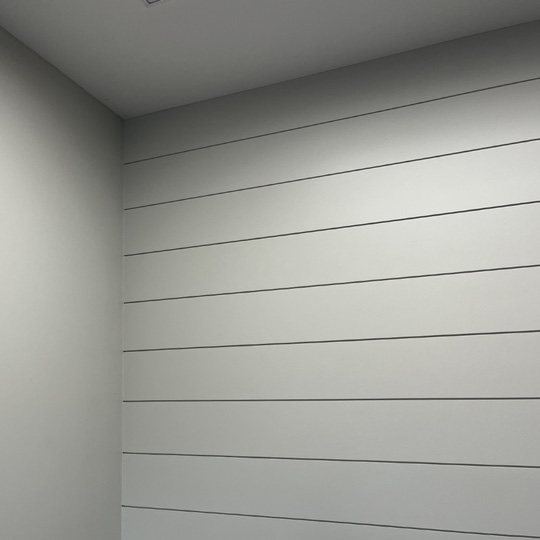 White painted shiplap wall