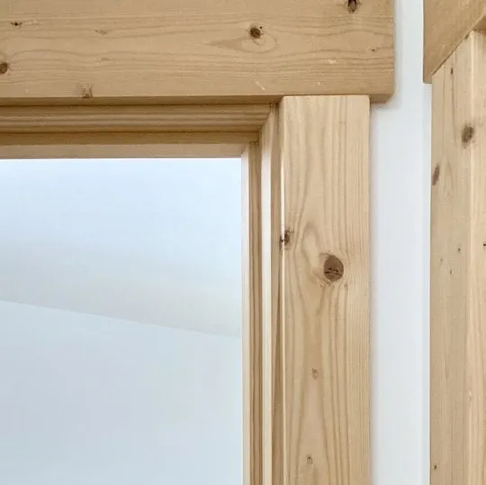 Clear-coated pine door trim