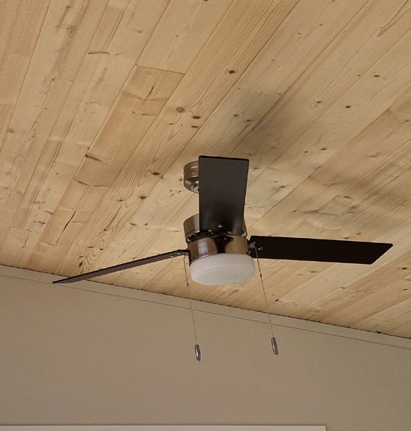 Pine tongue-and-groove ceiling with a ceiling fan
