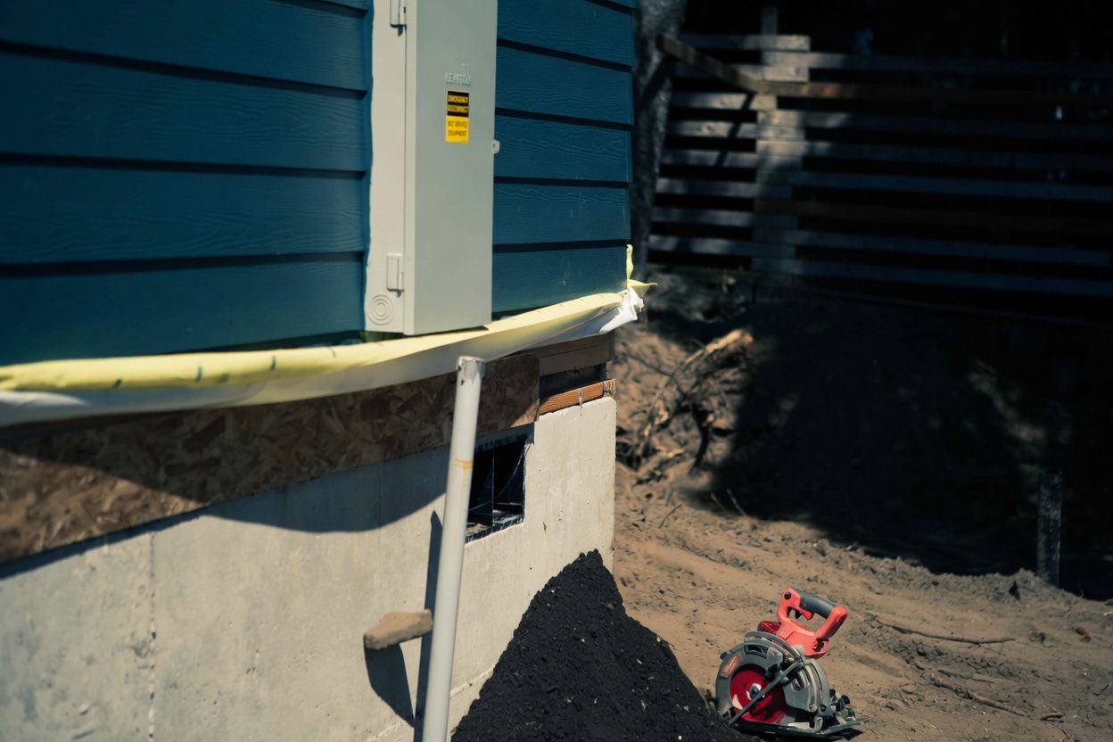 A Wolf crew member working at the foundation as a home is set