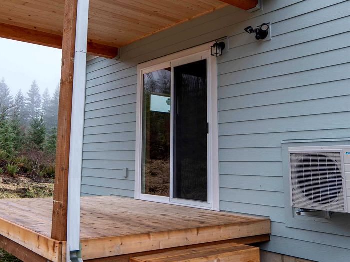 Sliding glass door in dark siding
