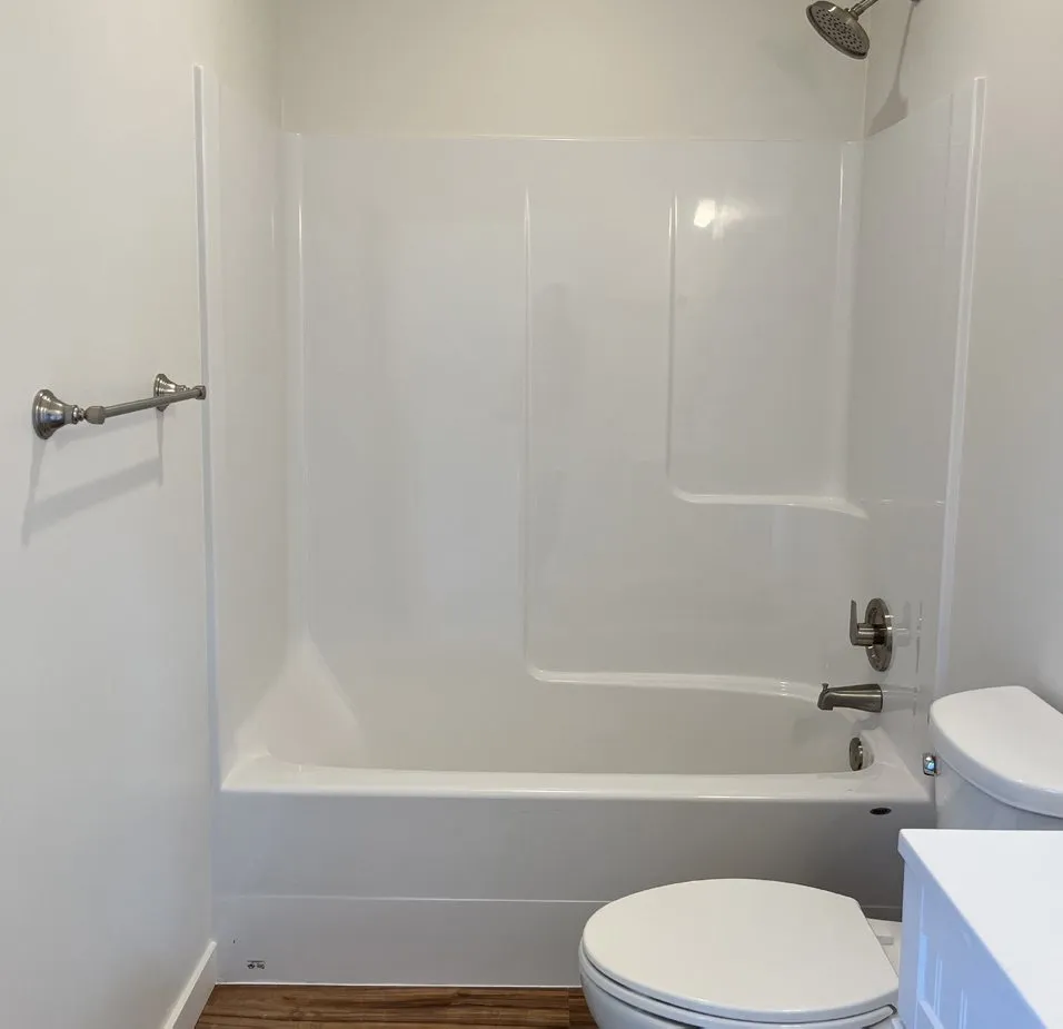 White fiberglass tub and shower