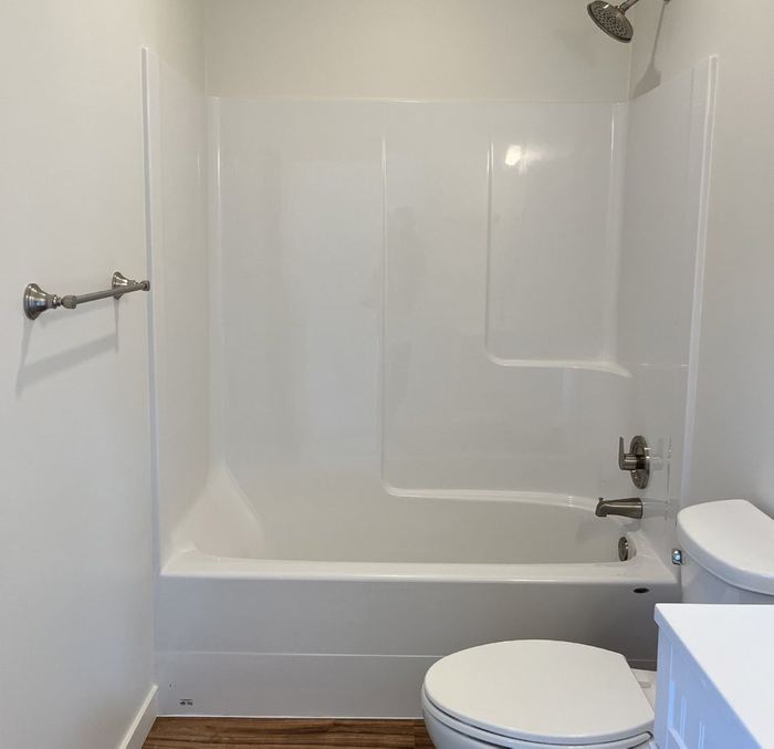 White fiberglass tub and shower