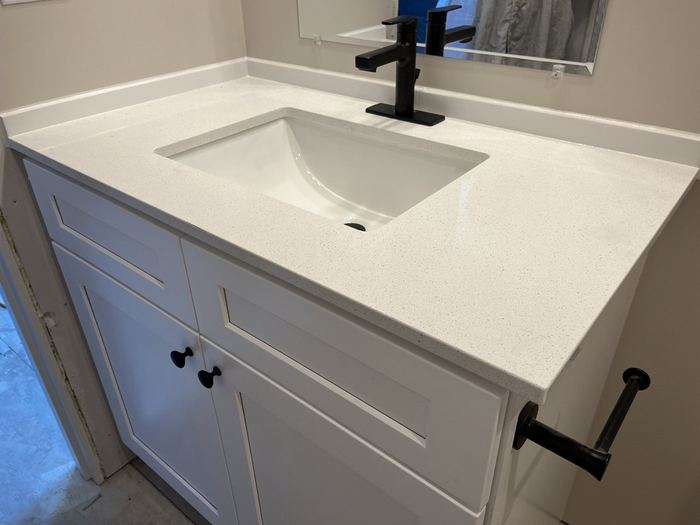 White Shaker vanity with black hardware