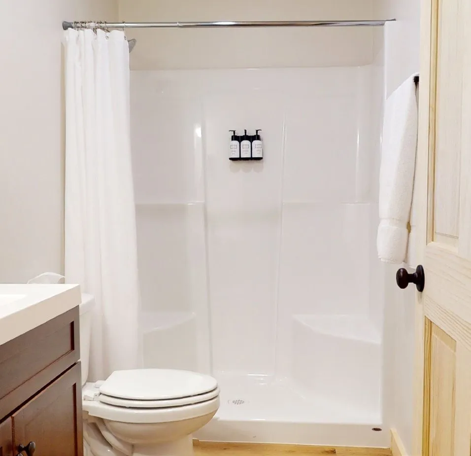 White fiberglass walk-in shower