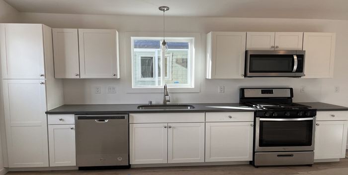 Single-wall white Shaker kitchen