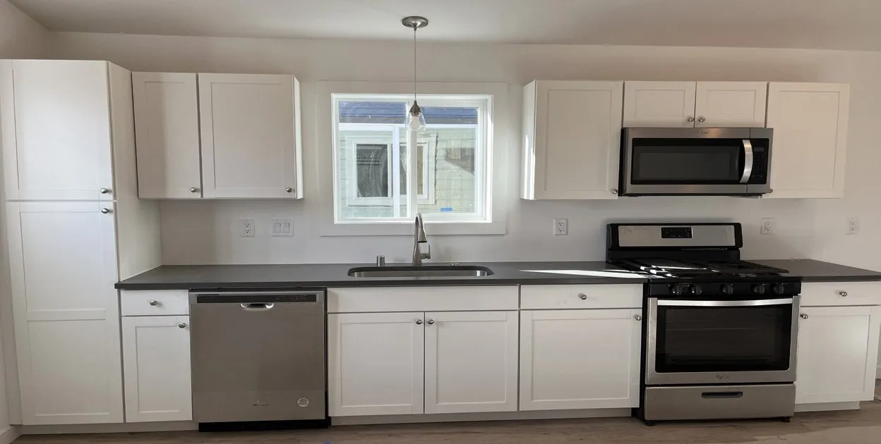 Single-wall white Shaker kitchen