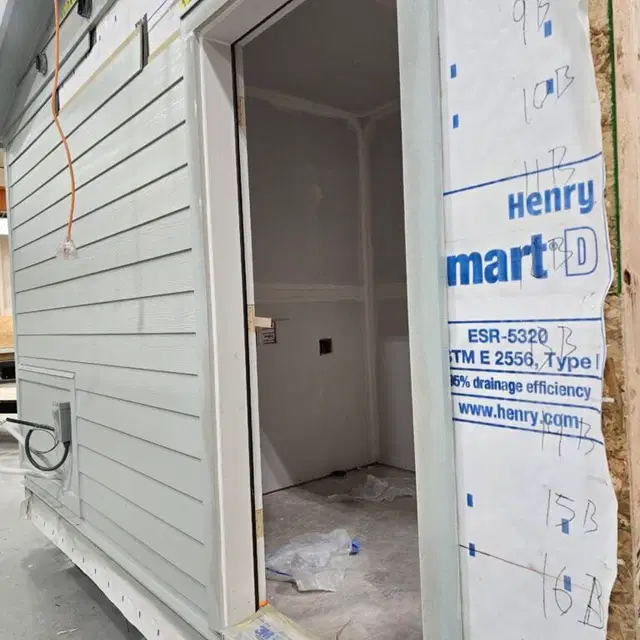 Unfinished entry doorway on a light gray Wolf Model L module in the shop.