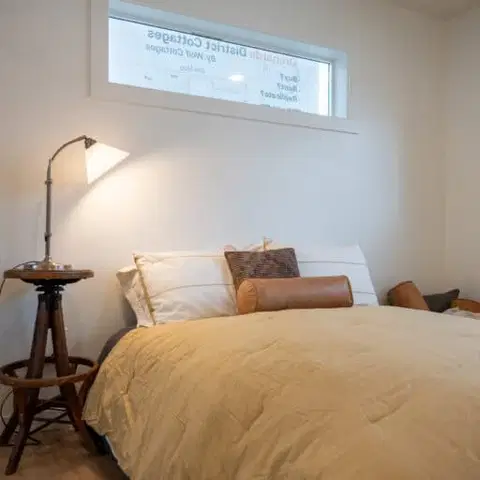 Main bedroom with a Wolf Model F home at Orchards District Cottages