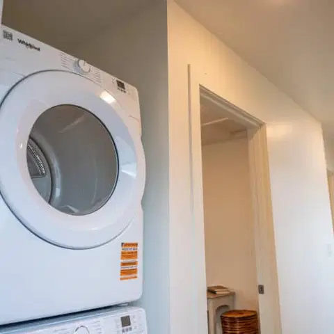 Stacked dryer in a Wolf Model F home at Orchards District Cottages