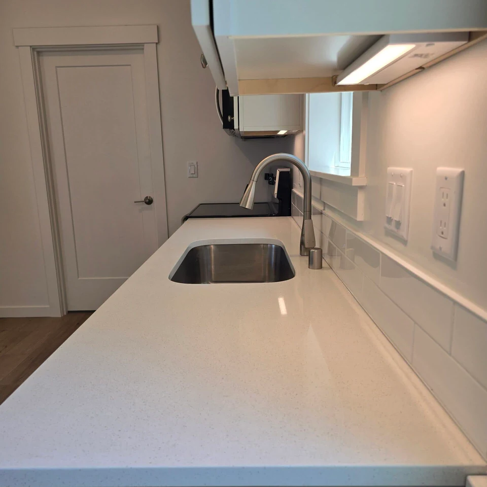 Granite Countertop with Undermount Sink in a Wolf Model B home.