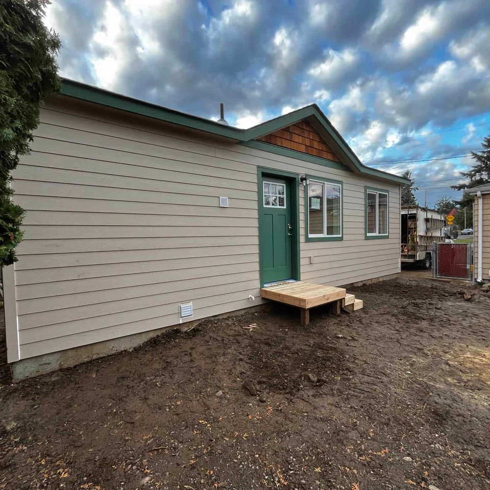 Tan and green Wolf Model B tiny home