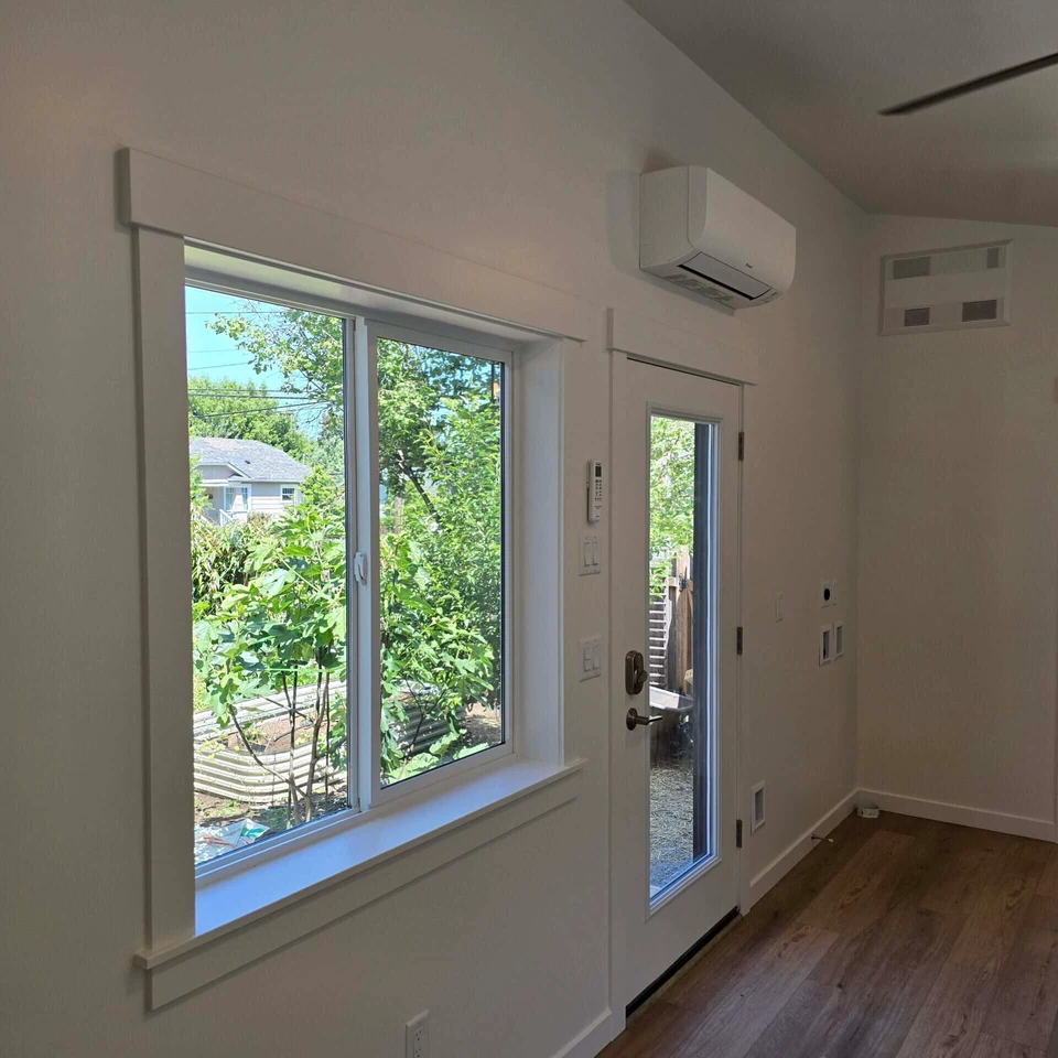 Front Entryway and Washer and Dryer area in a Wolf Model B home.