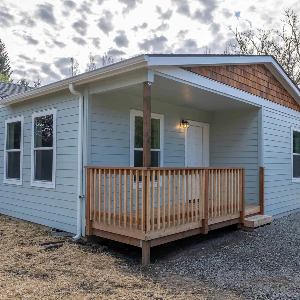 Covered front porch deck in a Wolf Model L home.