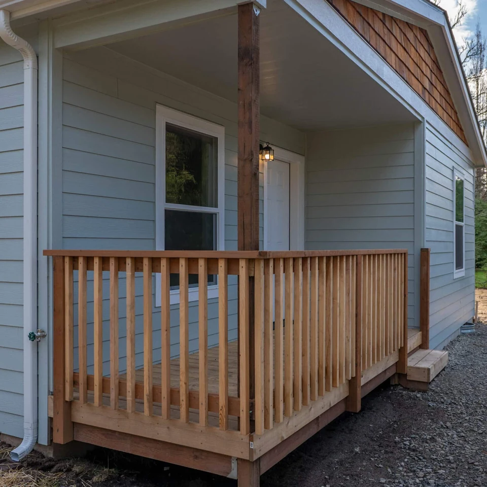 Covered front porch deck in a Wolf Model L home.