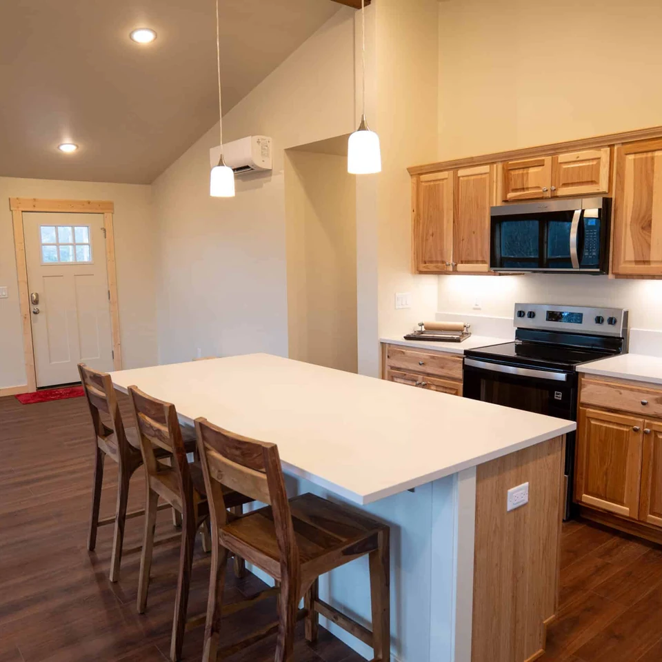 Kitchen in Wolf Model I home looking towards front door.