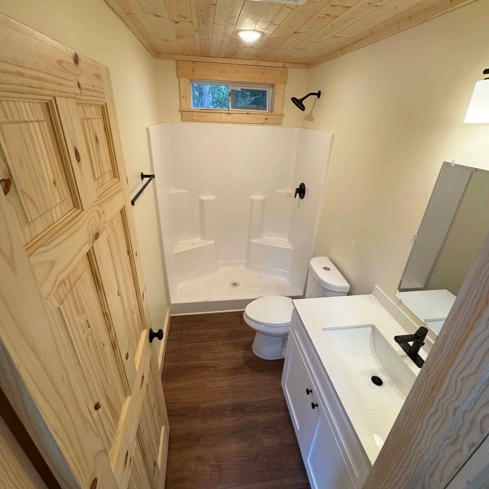 Bathroom with pine trim in a Wolf Model F home.