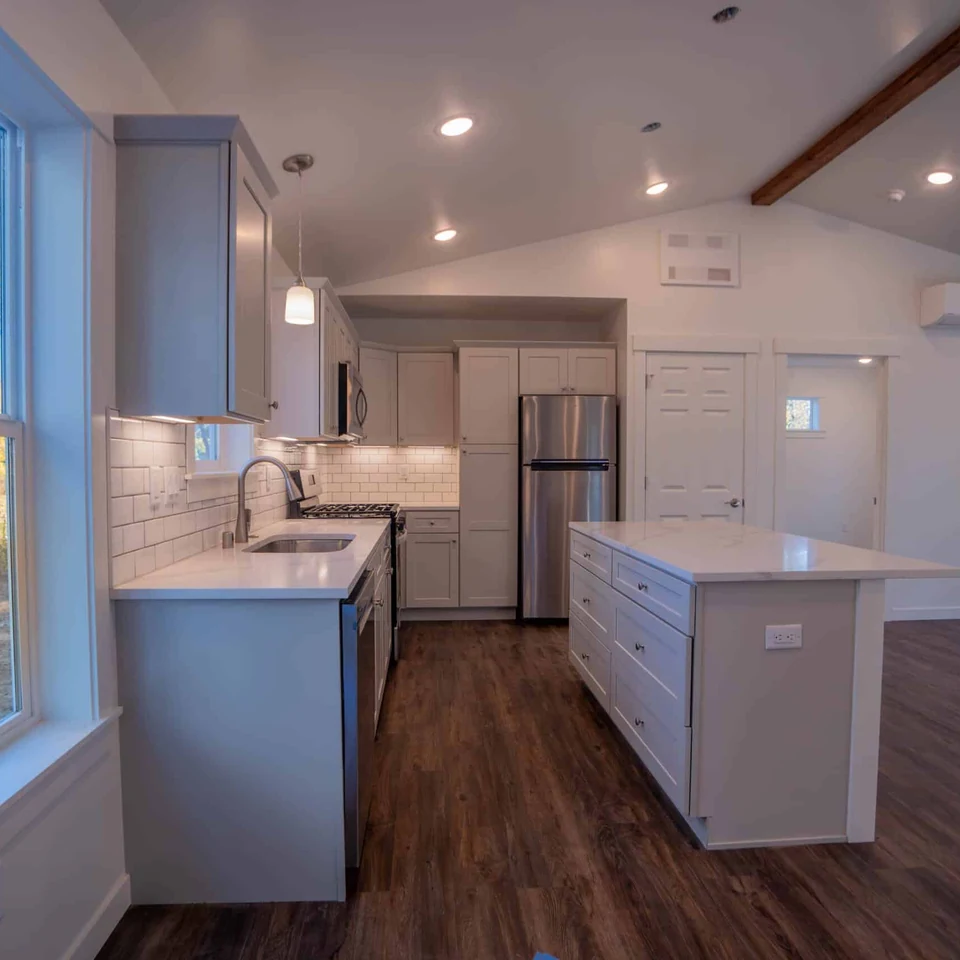 L-shaped island kitchen in a Wolf Model J modular home.