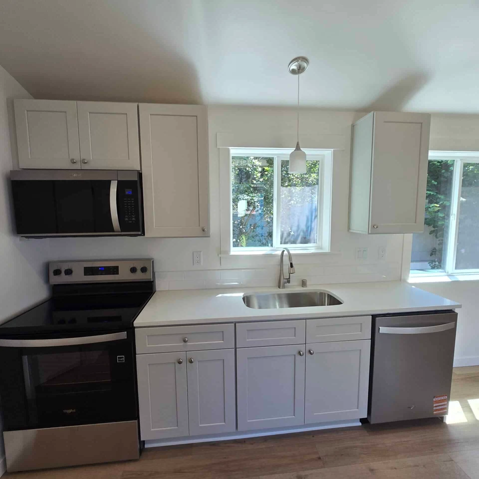 Single Wall Kitchen with Undermount Sink and Tile Backsplash in a Wolf Model B home.