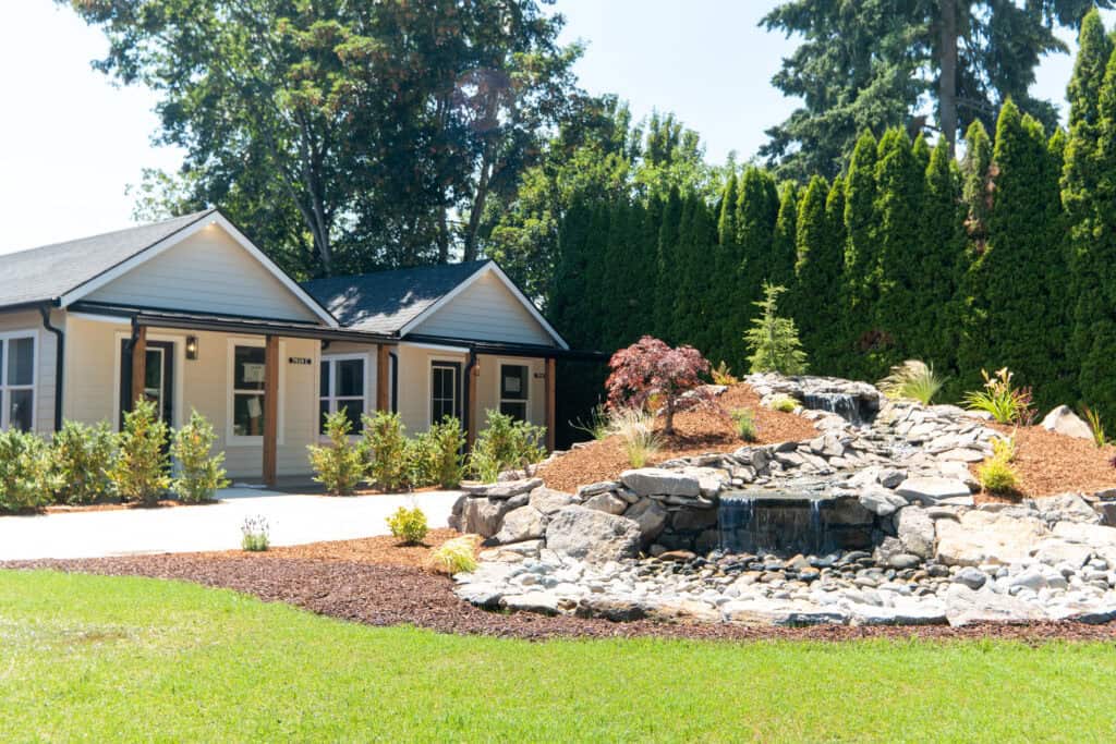 Wofl Odgen District Cottages fountain with two Model F cottages in the background. 