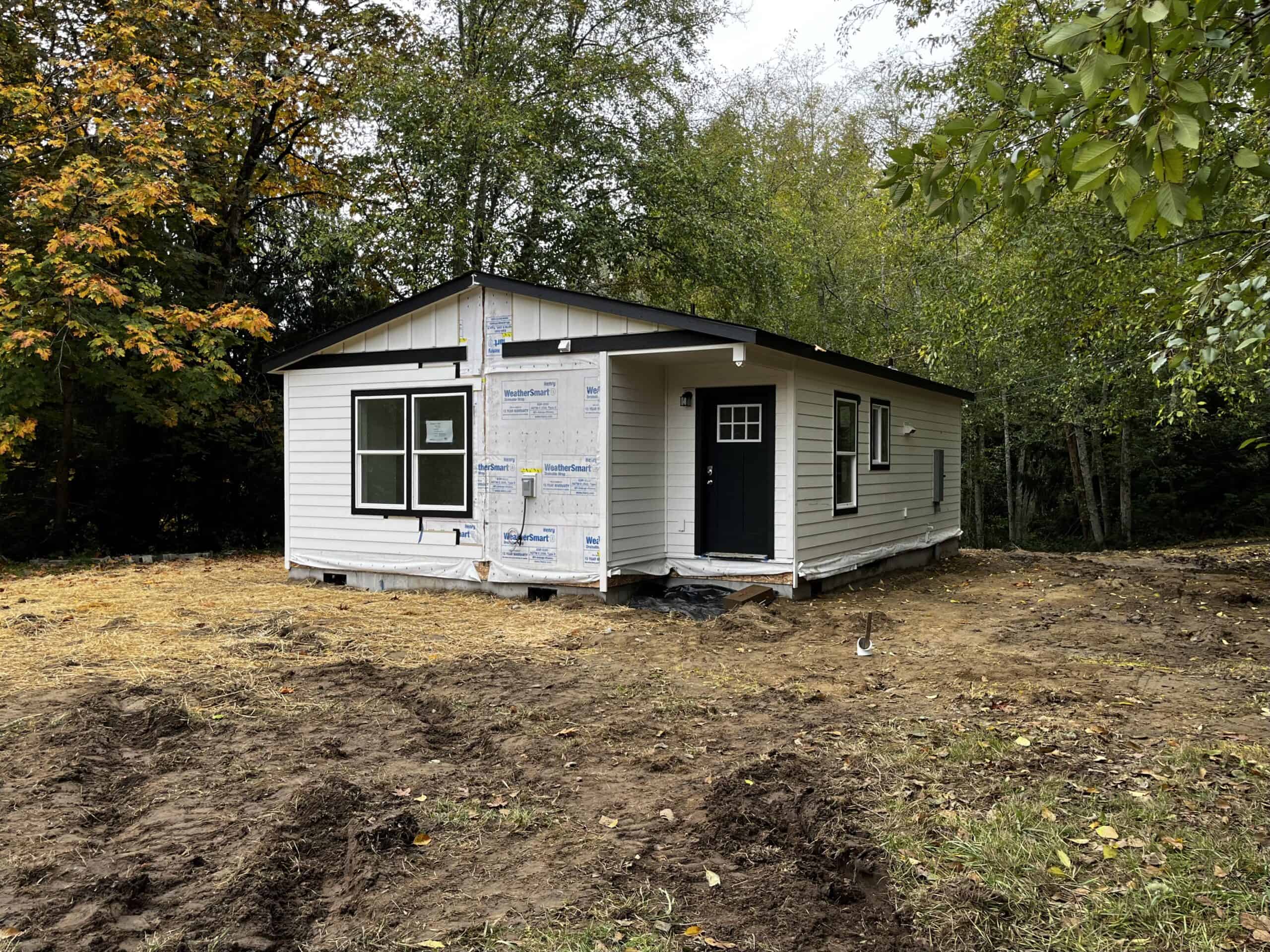 Black and white Wolf Model J home shortly after being placed on its foundation.