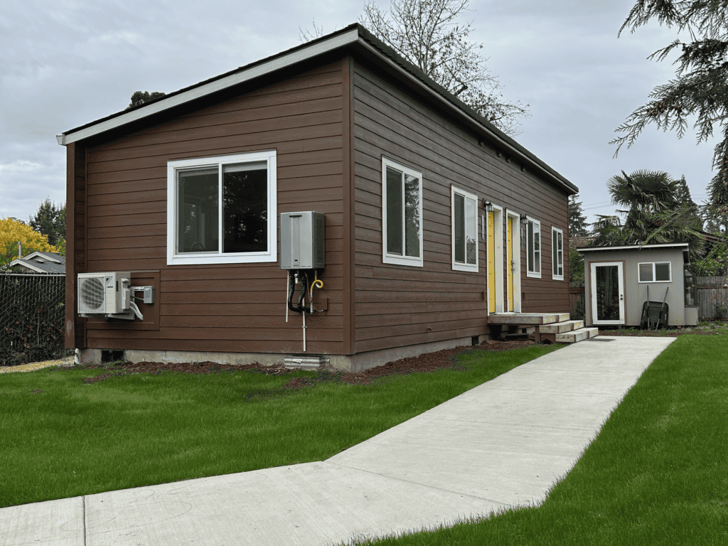 Wolf Model H duplex home with shed shingle roof.