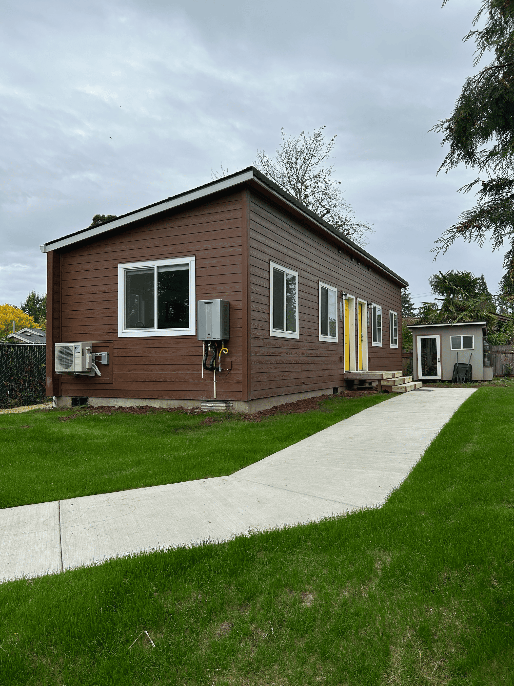 Wolf Model H duplex home with shed shingle roof.