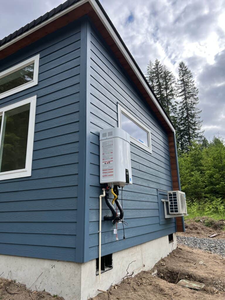 Blue and white Wolf Model E home with transom windows.