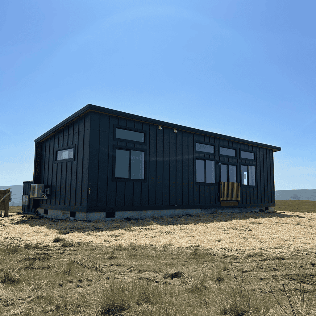 Black Wolf Model E home with board and batten siding.