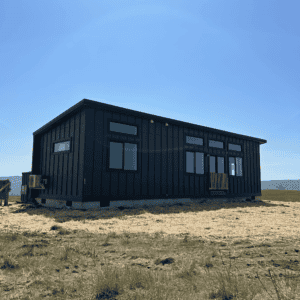 Black Wolf Model E home with board and batten siding.